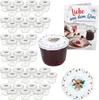A collection of small glass jars with lids, a jar of jam, and a recipe booklet, arranged on a white background. Produktbild-Vorschau