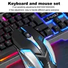 A close-up view of a gaming keyboard and mouse set with colorful LED lighting. Produktbild-Vorschau