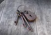 A set of old keys and a padlock on a wooden surface. Náhľad obrázku produktu