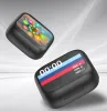 Two black earbud cases are shown against a light gray background. One case is in the foreground and displays a time of '00:00' and battery indicators. The other case is in the background and shows a screen with colorful app icons. Produktbild-Vorschau