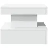 A white modern coffee table is shown from the front. Voir les images du produit