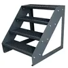 A four-step metal staircase with a grated surface. Produktbild-Vorschau