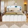 A bedroom with a white bed and nightstands. Anteprima dell’immagine prodotto