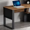 A close-up view of a modern desk with a laptop on it, showing the desk's structure and materials. Produktbild-Vorschau