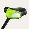 A close-up view of a bicycle seat with a black seat and a bright green frame around a white section. Anteprima dell’immagine prodotto
