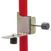 A close-up of a metal clamp attached to a red pole. Produktbild-Vorschau