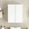 A white two-door bathroom cabinet mounted on a tiled wall above a toilet. Náhľad obrázku produktu