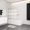 A modern bathroom with a bathtub, shower screen, vanity, and radiator. Produktbild-Vorschau