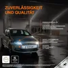 A silver car with its headlights on, parked in a dimly lit garage or parking lot. Text overlays highlight product features and brand. Produktbild-Vorschau