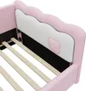 Close-up view of the headboard and slats of a pink upholstered bed frame. Náhled obrázku produktu