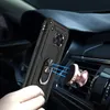 A hand holding a black phone case with a ring holder, near a rose gold magnetic car mount attached to a car's air vent. Produktbild-Vorschau