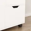 Close-up view of a white cabinet with a drawer and wheels. Podgląd zdjęcia produktu