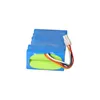 A battery pack with wires and a connector, isolated on a white background. Podgląd zdjęcia produktu