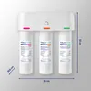 A white under-sink water filter system with three filter cartridges mounted on a wall. Produktbild-Vorschau