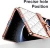 A close-up of a phone case with a quilted white texture and rose gold trim, showing a ring holder. Produktbild-Vorschau