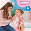 A mother and daughter are in a bathroom, with the daughter holding a baby doll. Produktbild-Vorschau