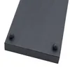 Close-up of the corner of a dark gray rectangular tray, showing two round feet. Voir les images du produit