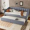 A daybed with a trundle bed pulled out, set up in a room with a rug and wall art. Náhled obrázku produktu