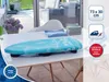 A table ironing board is placed on a table in a bright, modern room with large windows. Produktbild-Vorschau