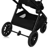 A close-up view of the wheels and storage basket of a black stroller. Produktbild-Vorschau