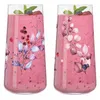 Two glasses filled with a pink berry smoothie, decorated with floral and leaf motifs. Anteprima dell’immagine prodotto