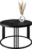 A black round coffee table with a vase of dried flowers and a cup of coffee on it. Produktbild-Vorschau