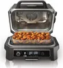 An open electric grill with chicken wings inside, displaying the control panel. Voir les images du produit
