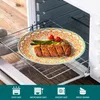 A plate of food is placed on a cooling rack inside an oven. Produktbild-Vorschau