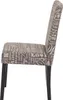 A side view of a dining chair with a text-patterned fabric seat and back, and dark legs, set against a white background. Produktbild-Vorschau