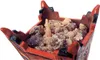 A close-up of frankincense resin in a decorative incense burner. Produktbild-Vorschau