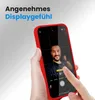 A hand holding a red phone case with a phone inside showing a selfie. Produktbild-Vorschau