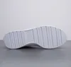 The sole of a white Puma sneaker is shown from an underneath view against a light gray and white background. Produktbild-Vorschau