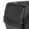 A close-up view of the top corner of a black plastic trash can with a lid. Podgląd zdjęcia produktu
