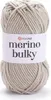 A ball of beige yarn with a white label. Produktbild-Vorschau