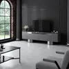 A modern living room with a TV and entertainment unit. Voir les images du produit