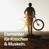 A person with a bicycle on a hilltop at sunset. Produktbild-Vorschau