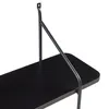 A close-up view of a black shelf and its mounting bracket. Produktbild-Vorschau