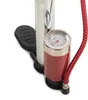 A close-up view of the base of a bicycle pump, showing the foot pedal, pressure gauge, and hose connection. Voir les images du produit