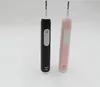 Two electric toothbrushes, one black and one pink, are displayed against a white background. Produktbild-Vorschau