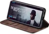 A smartphone in a brown flip case is displayed at an angle, showing a movie poster on its screen. Produktbild-Vorschau