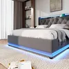A modern bedroom with a gray upholstered bed featuring LED lighting. Produktbild-Vorschau