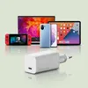 A collection of electronic devices including a Nintendo Switch, a smartphone, a tablet, and a charger. Anteprima dell’immagine prodotto