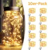 A jar filled with fairy lights and a set of 10 LED light strings with battery packs. Produktbild-Vorschau