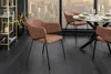 A dining room setting with chairs around a table, overlooking a city skyline. Produktbild-Vorschau