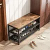 A shoe rack with a bench top, filled with shoes, placed in a hallway next to a closet. Podgląd zdjęcia produktu