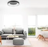A modern living room with a gray sofa, coffee table, and a large window overlooking a green landscape. Produktbild-Vorschau