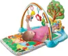 A baby playing on a colorful activity mat with a musical arch and toys. Produktbild-Vorschau