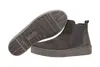 A pair of grey Chelsea boots shown from the side and underneath. Produktbild-Vorschau