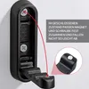 A black folding hook mounted on a white wall, with an inset showing a close-up of the magnetic closure. Produktbild-Vorschau