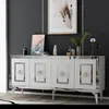 A white sideboard with silver accents and decorative elements on top, set against a dark gray wall. Anteprima dell’immagine prodotto